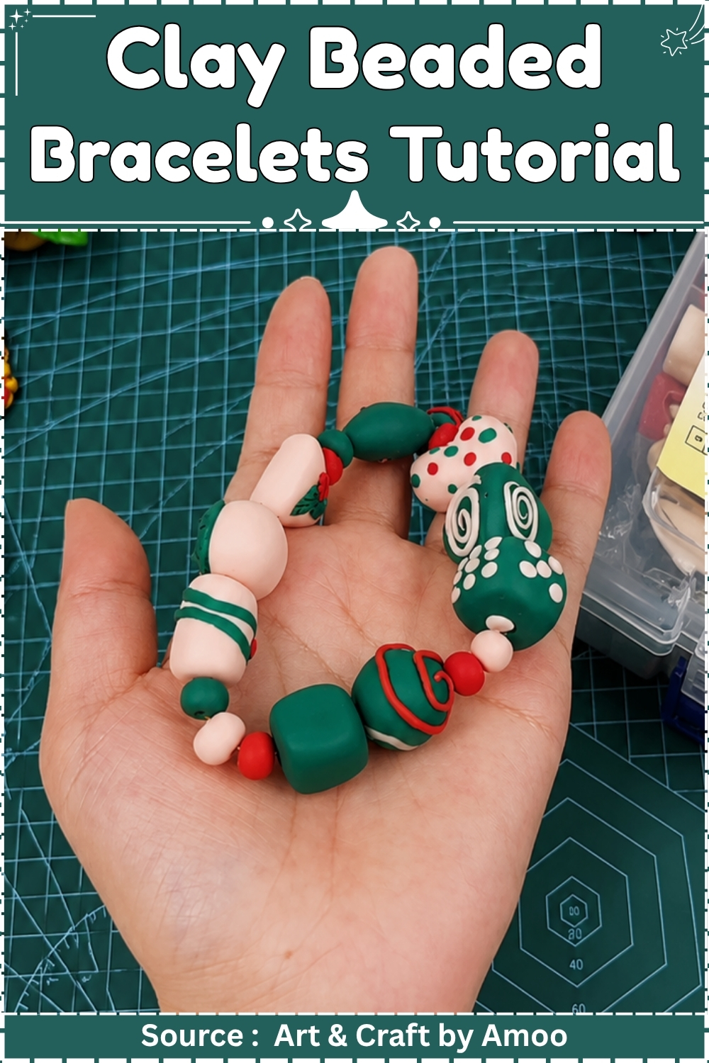 Handmade clay beaded bracelet in green, red and cream held in an open palm above a cutting mat